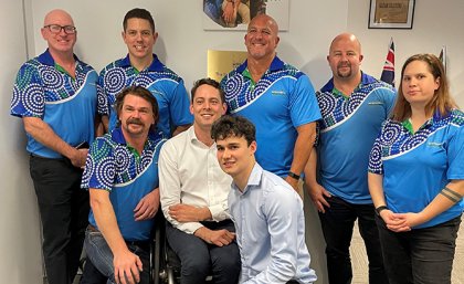 Denzel Strauss (foreground) at his scholarship presentation with Baidam Solutions staff including CEO Phillip (Pip) Jenkinson (kneeling in second row)